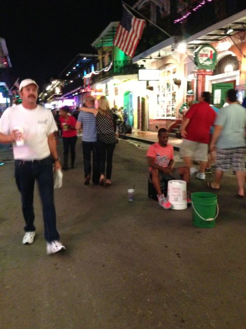 what's that in their hands? Drumsticks on the right and a H.A.B. on the left Bourbon Street