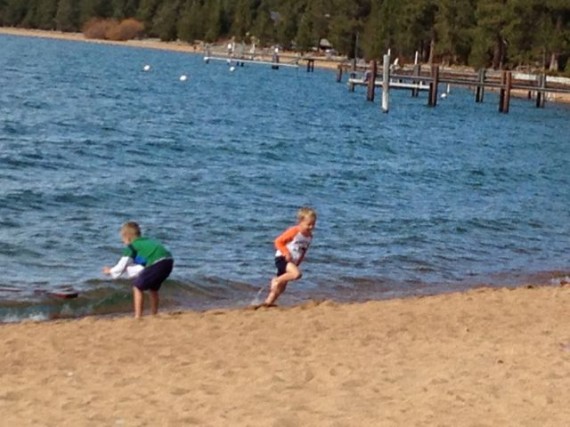 two young boys at Lake Tahoe's public beach in late Spring