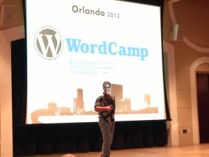 thank God for WordPress photo of jeff noel on stage at WordCamp Orlando 2012