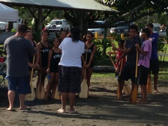 Rowing regatta group photo at Hilo Harbor beach