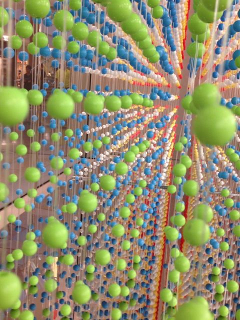 Apple Store window display of colorful beads promoting iPhone 5c