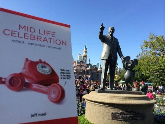 Midlife Celebration the book by Disneyland's partners statue