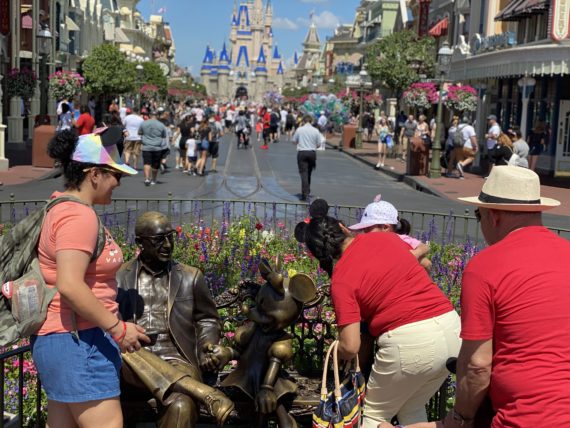 Roy Disney magic Kingdom statue bench
