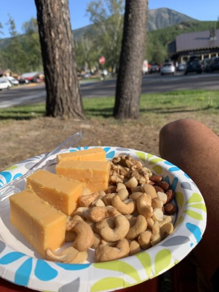 paper plate with nuts and cheese