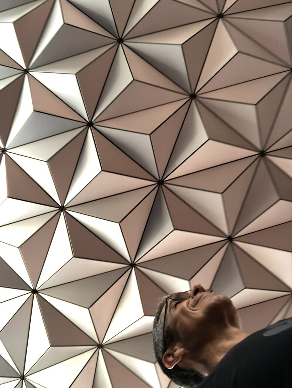 man under Epcot's Spaceship Earth