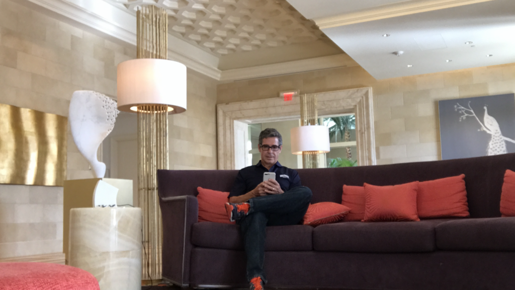 Disney author Jeff Noel writing in Resort lobby