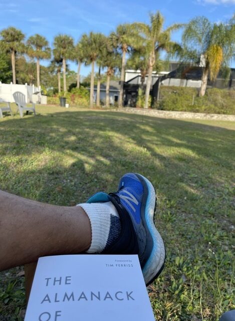view of backyard from man's seated point of view