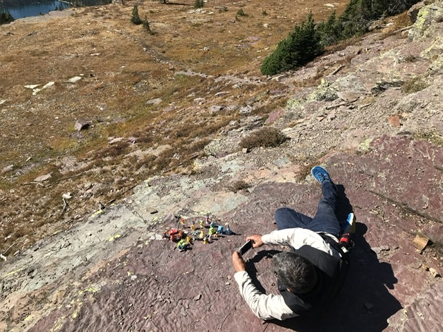 man on ground taking photo