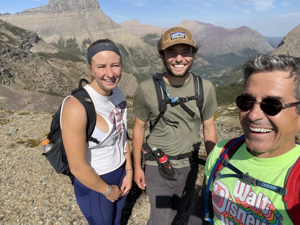 Three hikers on a mountain top