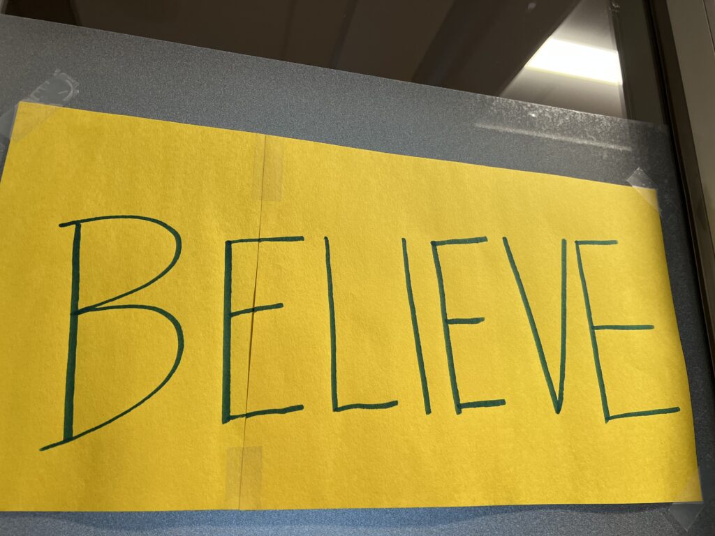 Yellow Believe sign