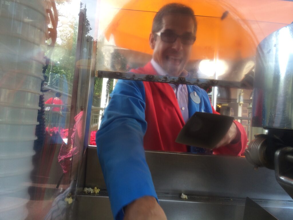 disney customer service speaker working popcorn cart
