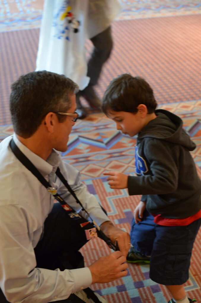 Disney Institute speaker pin-trading with a young Guest