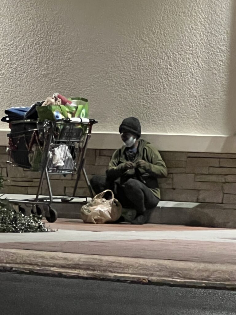 homeless person at grocery store