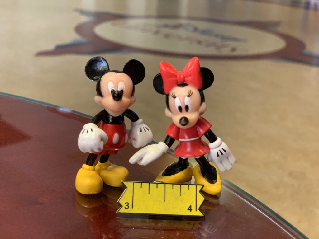 Mickey and Minnie Mouse small plastic toys at Disney University