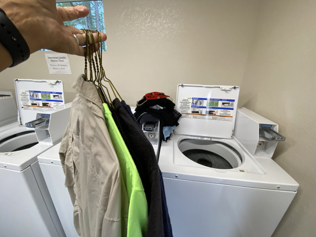 handful of laundry hanging from hangers