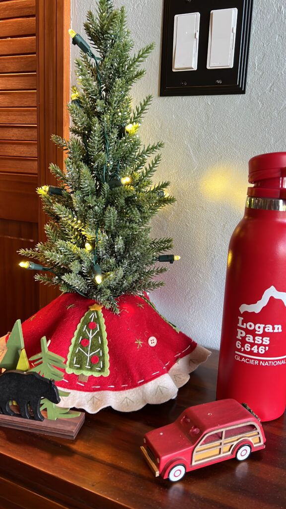 small Christmas tree and red water bottle