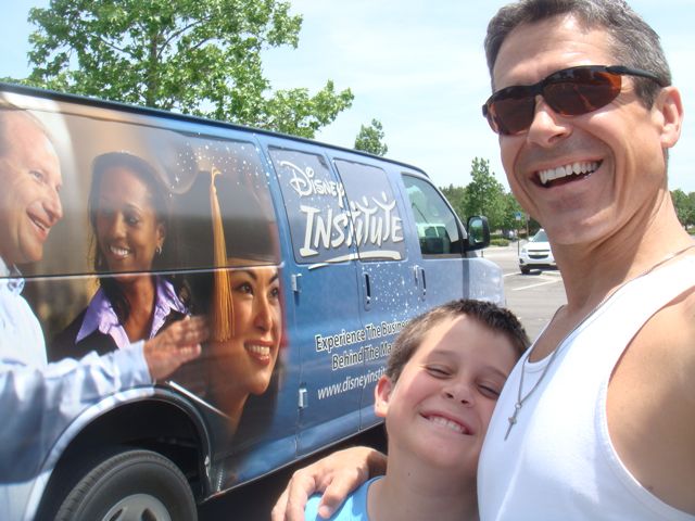 father and son next to Disney Institute van