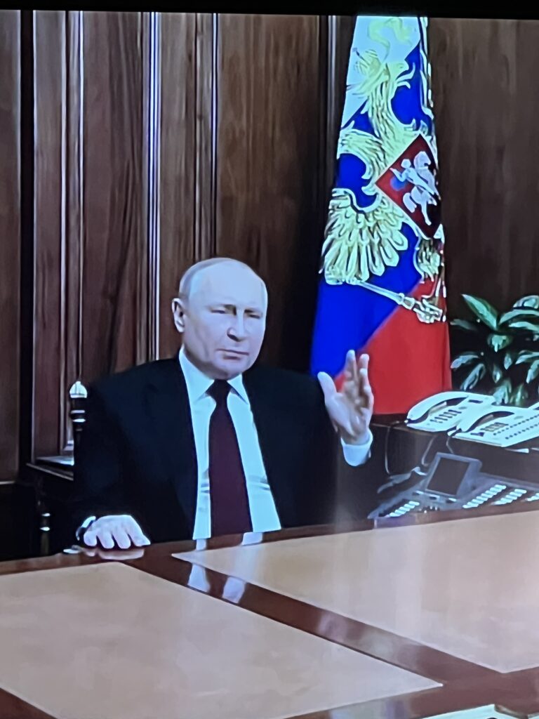 Vladamir Putin at a desk