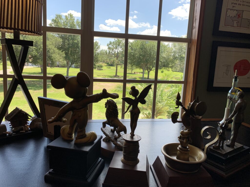 Disney Cast Member Service Awards on a desk