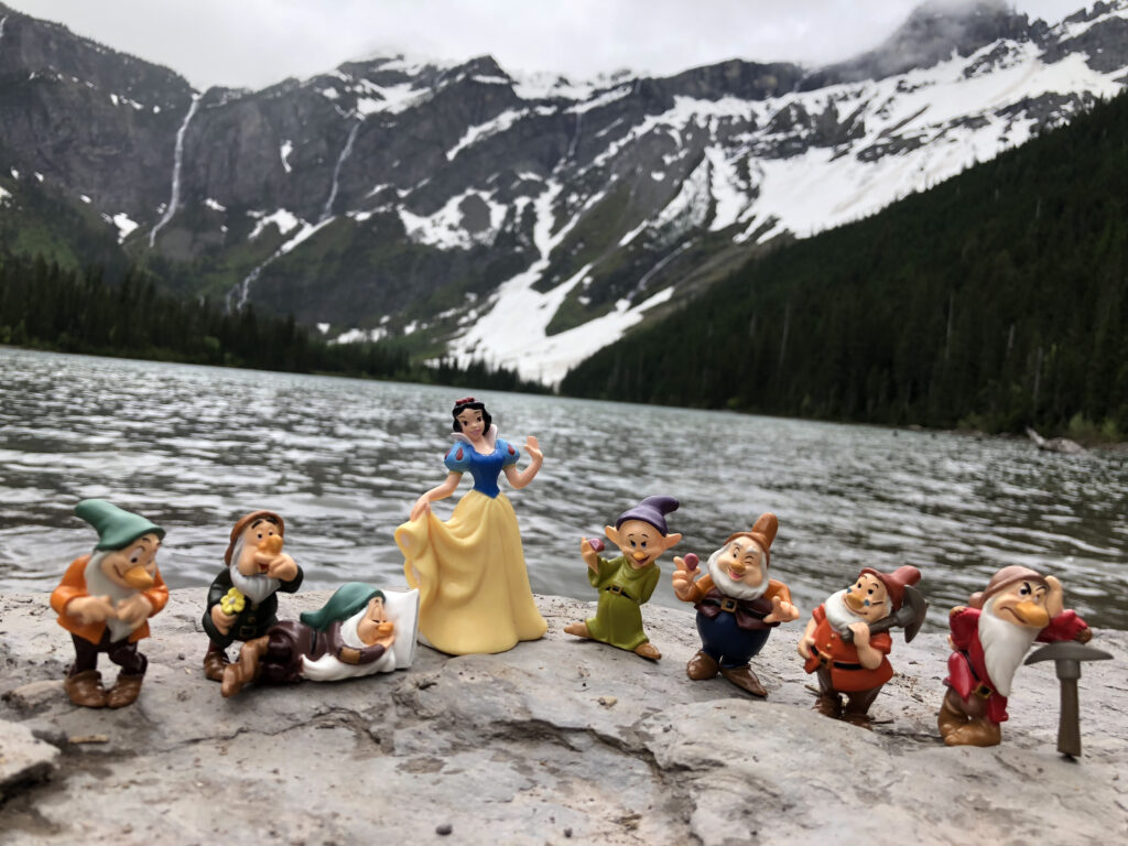 Disney character toys at mountain lake